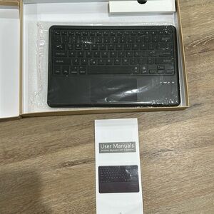 NWT Bluetooth keyboard with backlight. Works with 3 systems